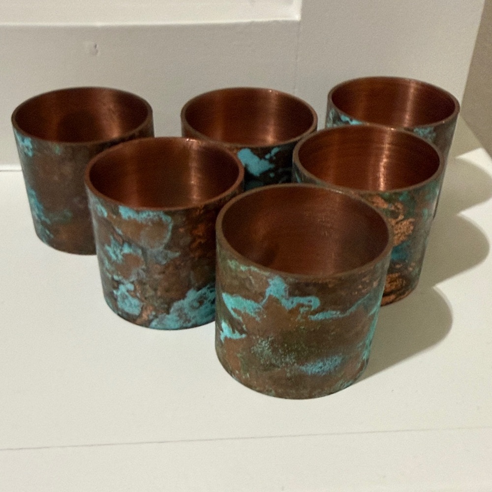 Set of 6 Copper and Patina napkins rings.